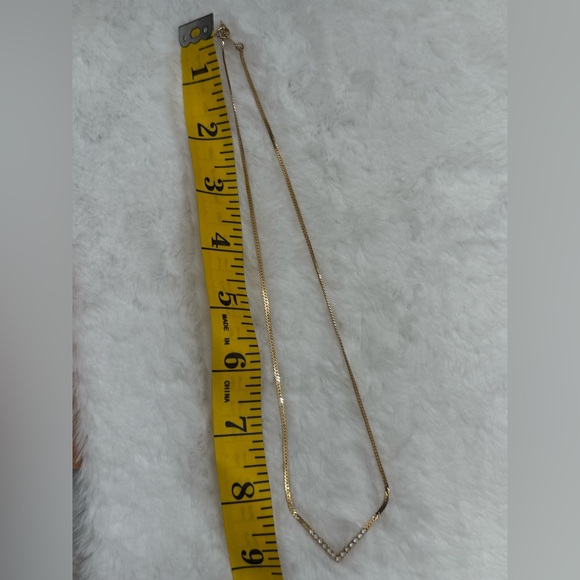 Vintage Avon gold-tone V-shaped pendant accented with clear crystal rhinestones - Picture 4 of 9